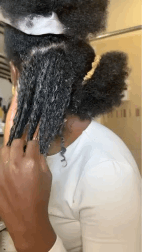 Knots Be Gone Pre-Poo Detangler infused with Ambunu leaves, perfect for melting away tangles and softening natural hair. A gentle, nourishing pre-shampoo treatment designed for kinky and coily hair textures.